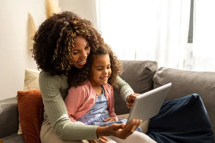 A parent and child together at home in Georgia