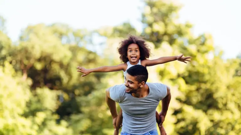 A father and daughter enjoying time outdoors — protecting your family's future through a Georgia divorce