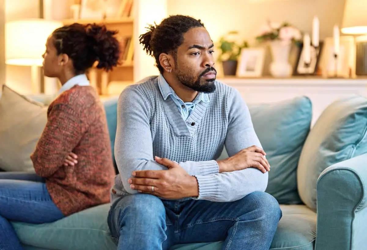 A couple sitting apart while considering a legal separation in Georgia